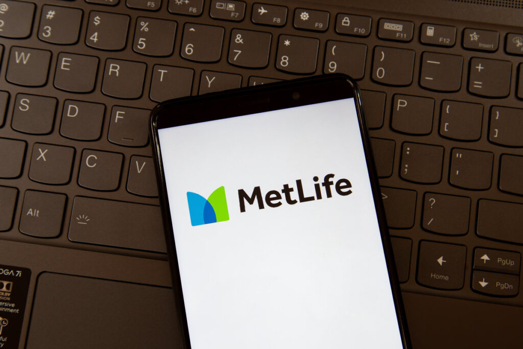 Toronto, On, Canada - December 19, 2021: MetLife logo on smartphone screen on a keyboard. MetLife Inc. is the holding corporation for the Metropolitan Life Insurance Company.